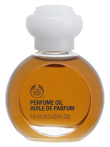 Frasco de Woody Sandalwood Perfume Oil, de The Body Shop